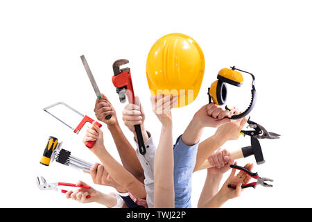 Close-up of People's Hand Holding Outils Menuiserie Against White Background Banque D'Images