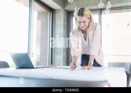 Businesswoman working in conference room in office