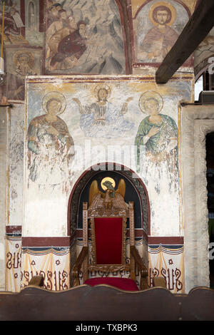 Anciennes fresques de Saint Jean et Jésus sur les murs du monastère de Saint Jean le Théologien entourant alcôve avec trône. Sur l'île de Patmos. Banque D'Images