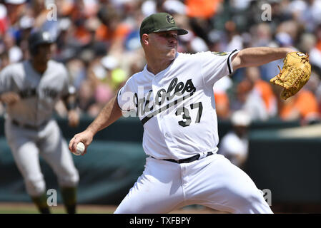 Baltimore Orioles starting pitcher Dylan Bundy reacts after center fielder Adam  Jones hit him with a pie after Bunday threw a one-hit baseball game against  the Seattle Mariners in Baltimore, Tuesday, Aug.