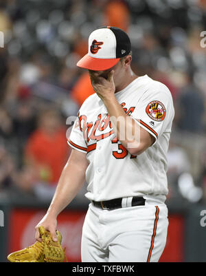 Baltimore Orioles starting pitcher Dylan Bundy reacts after center fielder Adam  Jones hit him with a pie after Bunday threw a one-hit baseball game against  the Seattle Mariners in Baltimore, Tuesday, Aug.