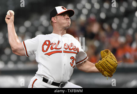 Baltimore Orioles starting pitcher Dylan Bundy reacts after center fielder Adam  Jones hit him with a pie after Bunday threw a one-hit baseball game against  the Seattle Mariners in Baltimore, Tuesday, Aug.