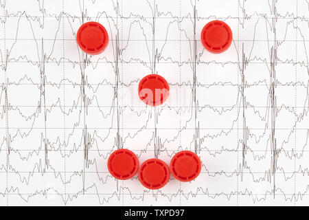 Face en red caps sur EKG graphique. La médecine. Banque D'Images