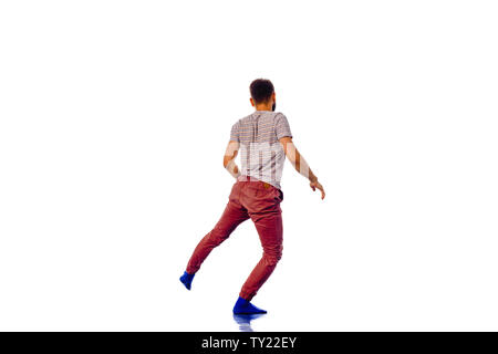 Disco Dancer montrant certains mouvements isolés contre fond blanc Banque D'Images