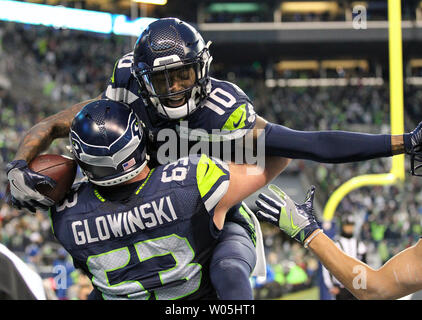 Seattle Seahawks center Joey Hunt (62) and offensive tackle Jalen McKenzie  (76) run a drill during the NFL football team's training camp, Wednesday,  Aug. 9, 2023, in Renton, Wash. (AP Photo/Lindsey Wasson