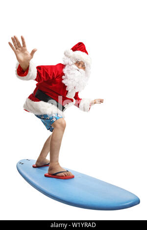 Tourné sur toute la longueur du père noël sur une maison de vacances surf isolé sur fond blanc Banque D'Images
