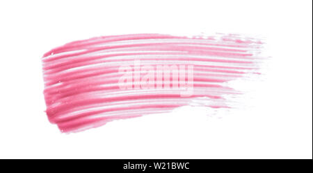 Traits rose doucement et la texture de la peinture acrylique ou brillant à lèvres isolé sur fond blanc Banque D'Images
