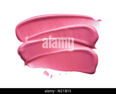 Traits rose doucement et la texture de la peinture acrylique ou brillant à lèvres isolé sur fond blanc Banque D'Images