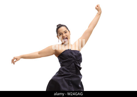 Jeune femme dans une élégante robe de saut et gesticulant bonheur isolé sur fond blanc Banque D'Images