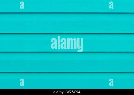 Table en bois peint en lignes. Les planches de bois turquoise brillant. Panneau rayé vert, la surface, le bois en planches en toile de fond. Des lattes de bois. Copier l'espace. Banque D'Images