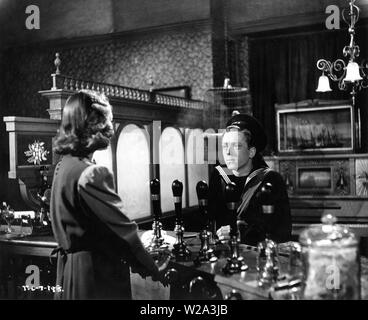 Richard Attenborough et Kay Young en DANS LEQUEL NOUS SERVONS 1942 Administration de Noel Coward et David Lean writer Noel Coward photographié par Ronald Neame deux villes producteurs Films / le London Symphony Orchestra (LSO) / British Lion Film Corporation Ltd Banque D'Images