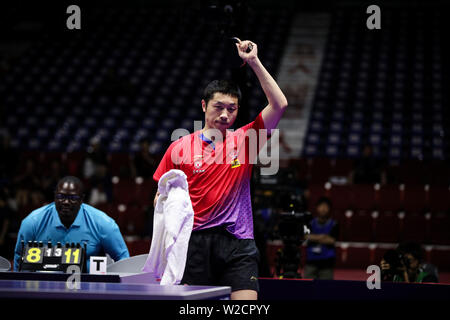 Xu Xin de Chine célèbre après avoir marqué contre ma longue de la Chine dans le match final du masculin au cours de l'Open de Corée SHINHAN la Seamaster 2019 World Tour de l'ITTF à Busan, Corée du Sud, le 7 juillet 2019. Xu Xin Long ma défaite 4-1 (7-11, 11-6, 11-9, 11-7, 11-8). Banque D'Images