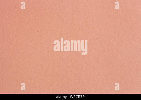 Mur peint orange abstrait. Texture couleur plâtre pour prix. Stuc vide de fond minimal. Surface texturée pour décor rose Banque D'Images