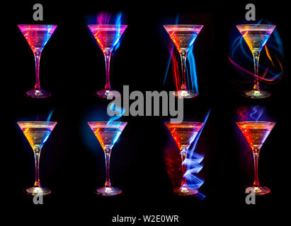 Lumineux colorés cocktails frais et moderne dans les verres sur fond noir avec reflet Banque D'Images