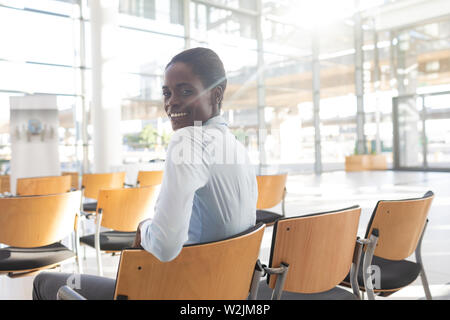 African-american woman sitting in conference room Banque D'Images