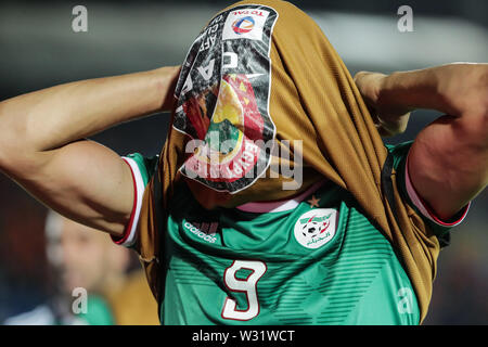 Suez, Egypte. 11 juillet, 2019. L'Algérie a Bagdad Bounedjah réagit après le coup de sifflet final de la coupe d'Afrique des Nations 2019 Quart de finale match de football entre la Côte d'Ivoire et l'Algérie au stade sportif de Suez. Credit : Oliver Weiken/dpa/Alamy Live News Banque D'Images