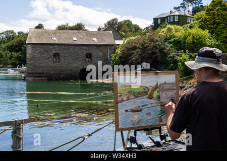 Homme artiste peinture de la côte scène Castlehaven,West Cork,Irlande Banque D'Images