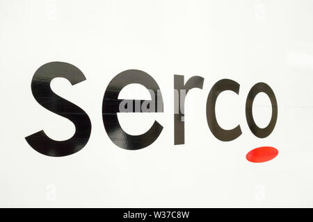 Close-up of a Serco Group plc logo Banque D'Images