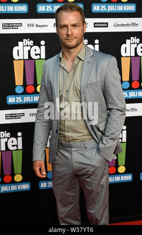Cologne, Allemagne. Le 13 juillet, 2019. L'acteur Hinnerk Schönemann vient à la première du film 'Die Drei ! ! !'. Credit : Henning Kaiser/dpa/Alamy Live News Banque D'Images