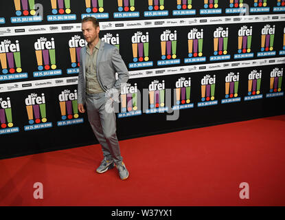 Cologne, Allemagne. Le 13 juillet, 2019. L'acteur Hinnerk Schönemann vient à la première du film 'Die Drei ! ! !'. Credit : Henning Kaiser/dpa/Alamy Live News Banque D'Images