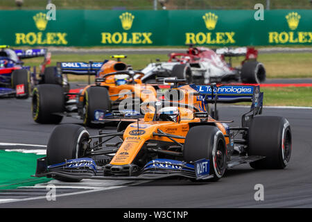 Silverstone, UK. 14 juillet 2019. FIA F1 Grand Prix de Grande-Bretagne, la Journée de la course, Carlos Sainz Jr au volant de sa McLaren F1 Team MCL34 mène de coéquipier Lando Norris : Action Crédit Plus Sport Images/Alamy Live News Banque D'Images