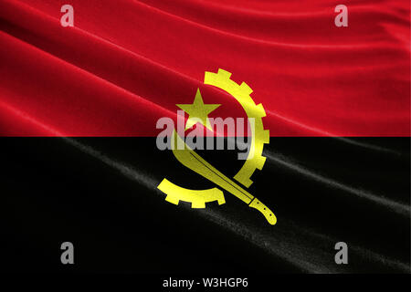Drapeau réaliste d'Angola sur la surface d'un tissu Banque D'Images