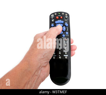 Gros plan horizontal de a woman's hand holding a commande à distance sur un fond blanc. Banque D'Images