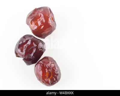 Soudage de jujube fruits sur fond blanc, Chinois, singe date bouillie apple de sirop. Date chinois lien ou lien Jujube est meilleur dessert et meilleure trad Banque D'Images