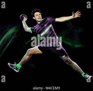 Portrait d'un joueur de handball jeune homme isolé sur fond noir avec effet peinture lumière vitesse de flou Banque D'Images