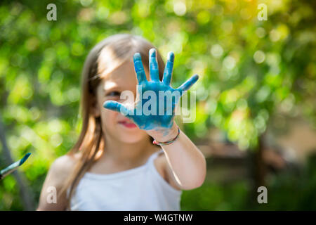 Girl's blue Painted Hand Banque D'Images