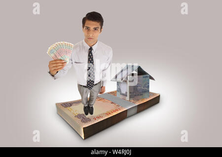 Portrait of a businessman showing banknotes Stock Photo