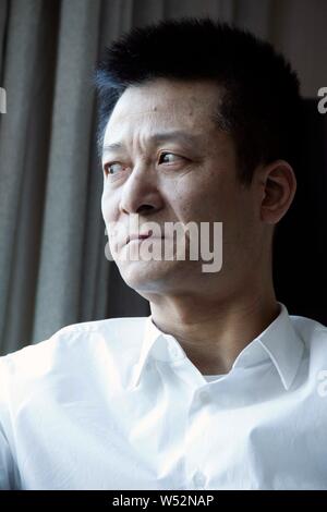 --FILE--Shu Yuhui, fondateur et président du groupe Quanjian, est photographié lors d'une entrevue à Tianjin, Chine, 8 mars 2014. Un total de 18 personnes ont être Banque D'Images