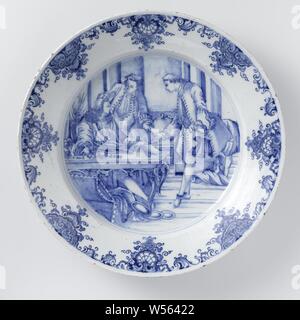 Plat à la Division des produits à partir de la parabole du fils prodigue plat avec le partage des biens de la parabole du fils prodigue, plat de la faïence. Peint en bleu avec une scène de 'The Lost Son', le fils prodigue demande son héritage, son père lui donne (un sac de) l'argent, anonyme, Delft, c. 1740 - c. 1775, d 38 cm Banque D'Images