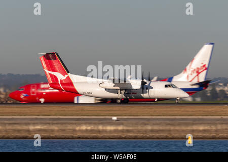 QantasLink de Havilland Canada Dash 8 lits 1 turbopropulseurs avion régional décollage à partir de l'air de Sydney Banque D'Images