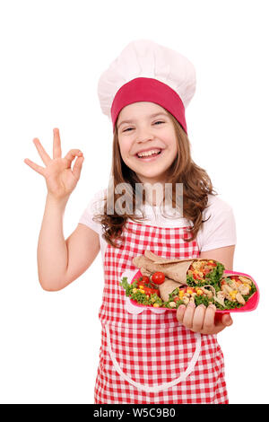 Happy little girl cook avec burritos mexican food Banque D'Images