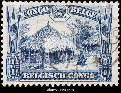 Huttes tribales sur l'ancien Congo belge de timbres Banque D'Images