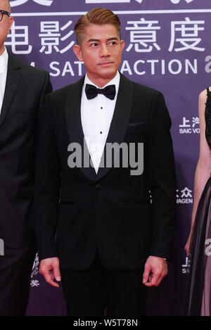 Hong Kong, chanteur et acteur Aaron Kwok pose comme il arrive sur le tapis rouge pour la 25e cérémonie de remise des prix à Huading Macao, Chine, 12 juin 2019. Banque D'Images