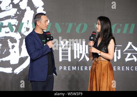 L'actrice chinoise Tang Wei, droite, et l'acteur Huang Jue assister à la première manifestation pour nouveau film "Long Day's Journey into Night' à Beijing, Chine, 24 déc. Banque D'Images