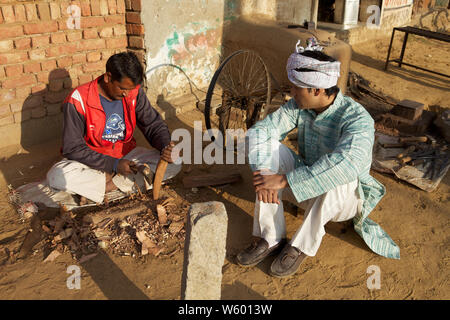 Blacksmith making a hammer Stock Photo