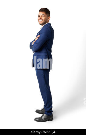 Confiant d'affaires arabes homme posant sur fond blanc, Side View Banque D'Images