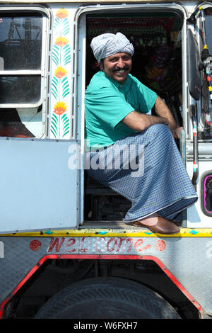 Truck driver sitting in a truck Stock Photo