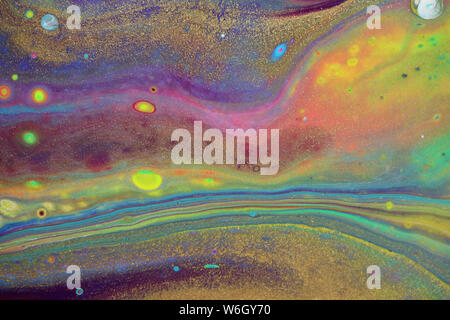 Peinture acrylique abstraite dans un arc-en-ciel de couleurs néon lumineux pour les fonds. Banque D'Images