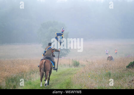 Lauder, ÉCOSSE - 03 août : équitation 2019 Commune de Lauder. Christopher Purves, Lauder Cornet 2019 avec le standard de Burgh le Golf galloping jusqu'au début de la balade. Lauder circonscription commune fait partie d'une tradition de circonscriptions communes similaires et de festivals dans le sud de l'Écosse et de frontières. L'événement principal est une circonscription de plus de 300 chevaux autour de la terre commune de Lauder. La principale Rideout est toujours le premier samedi d'août et est l'aboutissement de toute une semaine d'événements. Lauder circonscription commune est fier d'être l'un des premiers et des plus anciennes circonscriptions communes frontalières. Banque D'Images