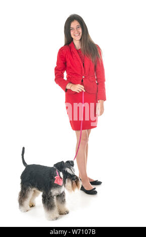 Schnauzer nain et woman in front of white background
