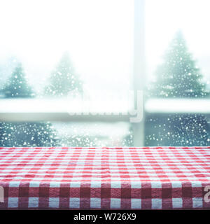 Nappe à carreaux Vue supérieure avec la texture de l'arrière-plan de la vue de la fenêtre de neige.pour décoration de Noël ou Nouvel an concepts Banque D'Images