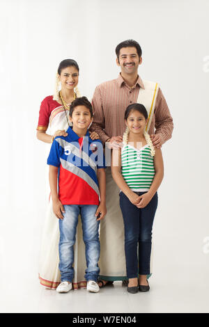 South Indian family standing together Stock Photo