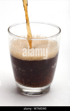 Soft drink being poured into a glass Stock Photo