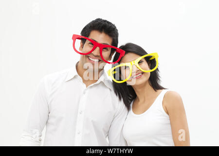 Young couple wearing eyeglasses and smiling Stock Photo