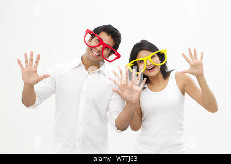 Young couple wearing eyeglasses and smiling Stock Photo