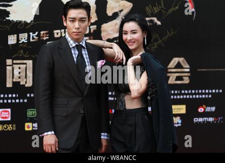 L'actrice Cecilia Cheung de Hong Kong, à droite, et le chanteur et acteur Choi Seung-hyun, mieux connu sous le nom de T.O.P, de la bande de garçon de la Corée du Sud Les fatals picards Banque D'Images
